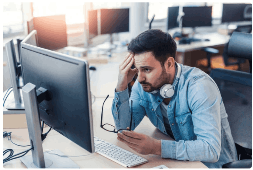 Frustrated land engineer using computer